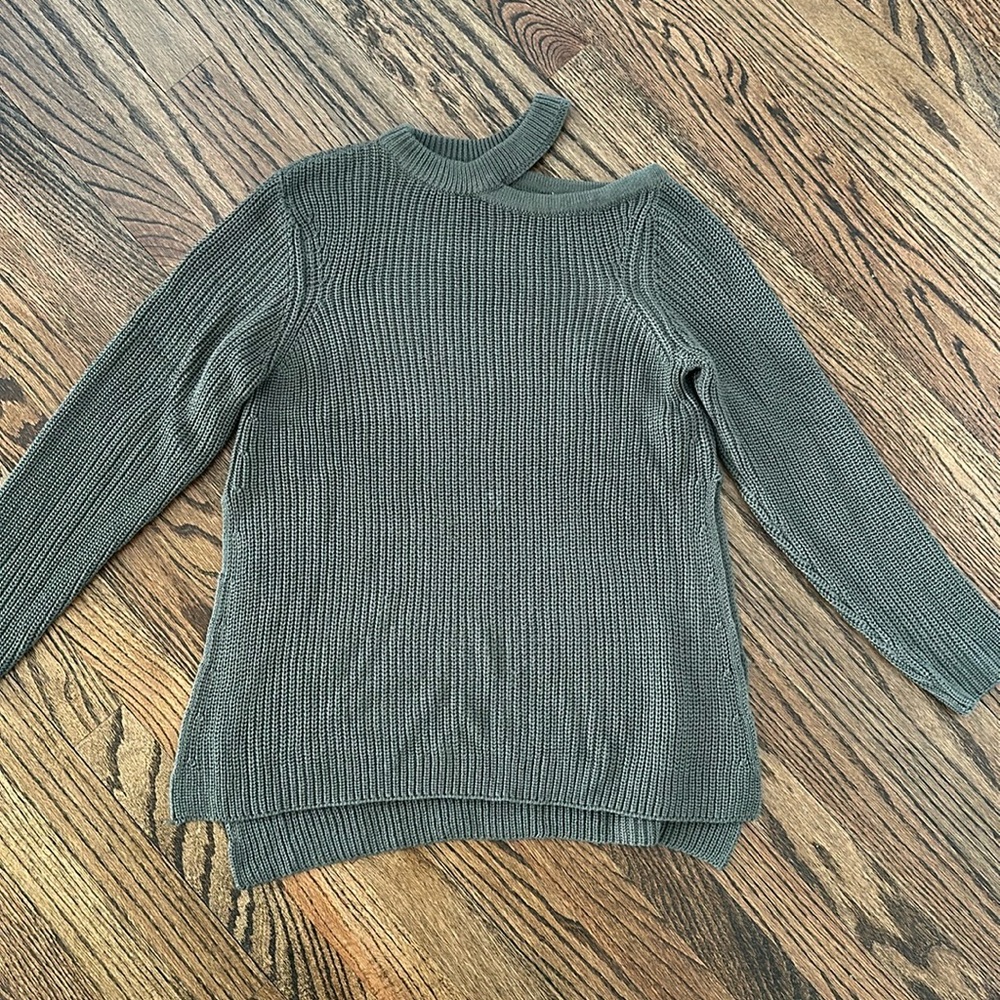 Knit split hem sweater with drop shoulder.